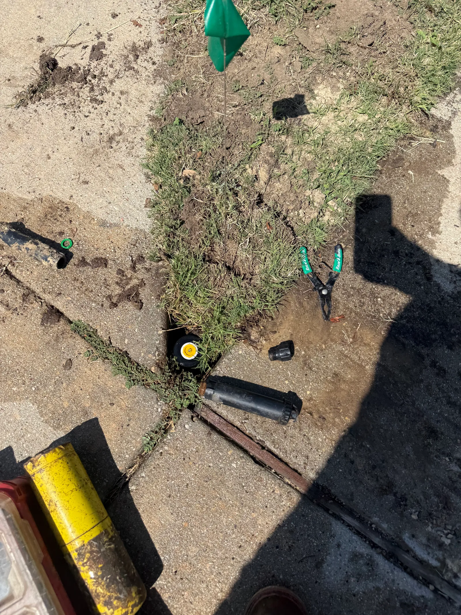 Rain Bird sprinkler head components during a repair by JC Apex Home Services