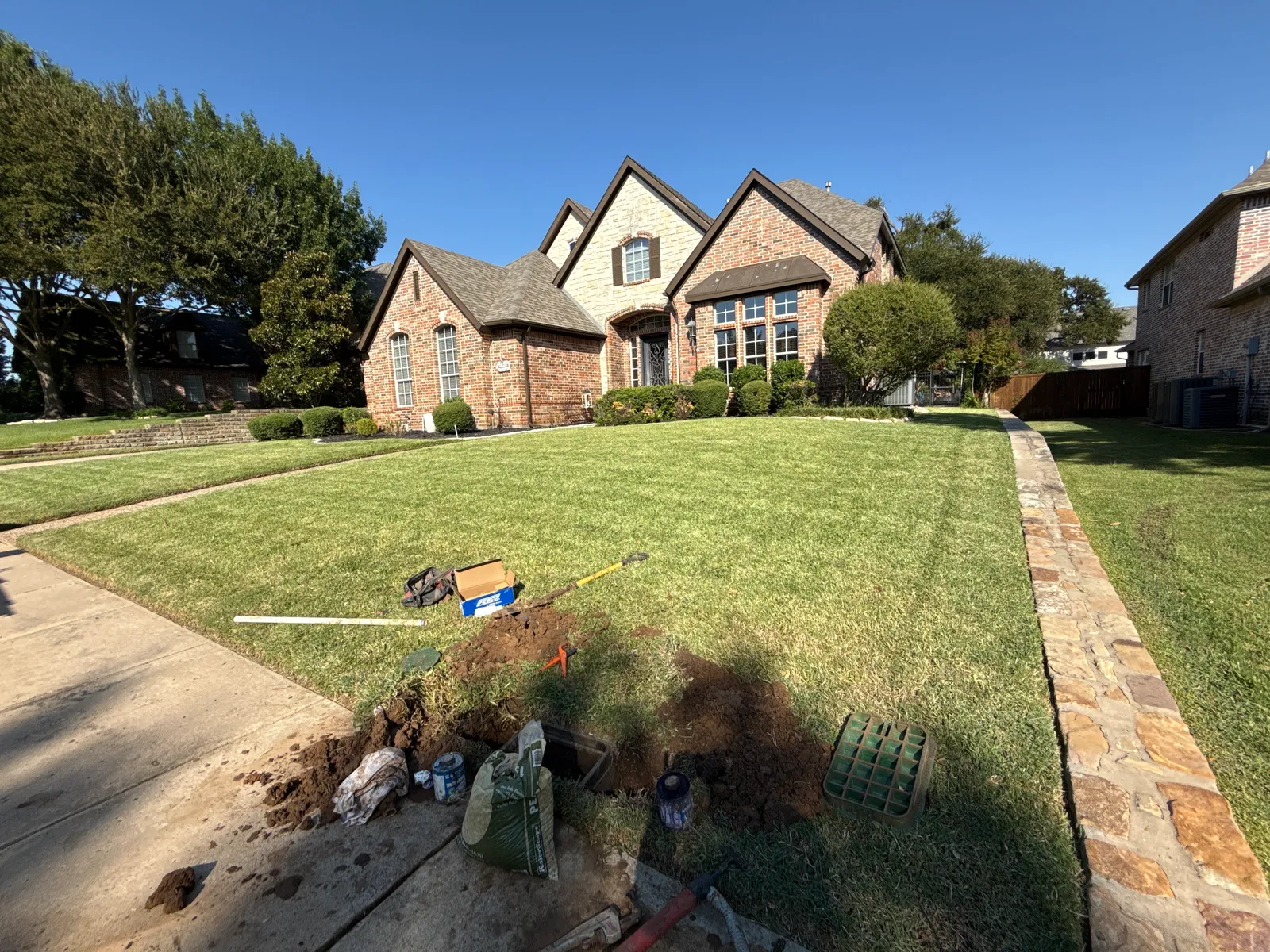 JC Apex Home Services sprinkler repair worksite at a Plano TX residential home